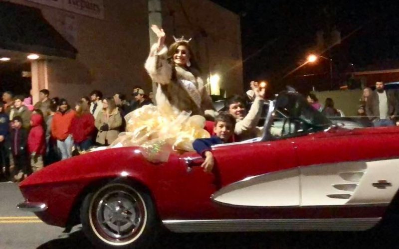 Miss North Carolina Laura Matrazzo rides in a vintage Corvette provided by Wayne Thomas Chevrolet in the 2018 Asheboro Christmas Parade. (The North State Journal)