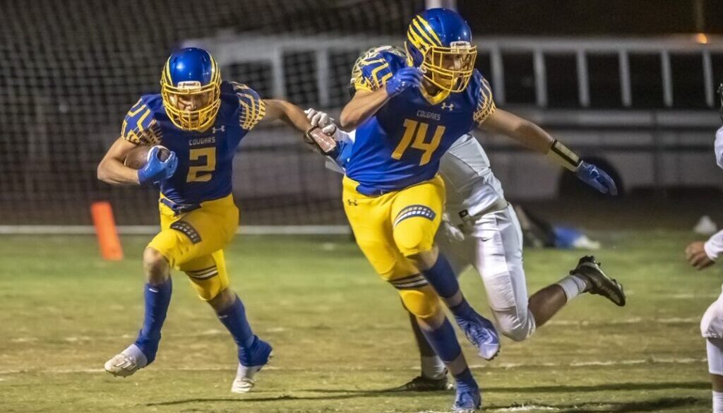 SWR football Adam Cole runs behind Eli Gravely v ER in 2022