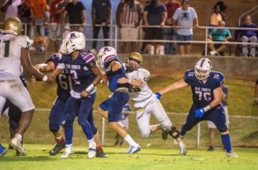 ER football Will Stalker tackles Asheboro WR Ben Luck Aug2023