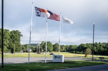 Klaussner Furniture with flags Aug2023