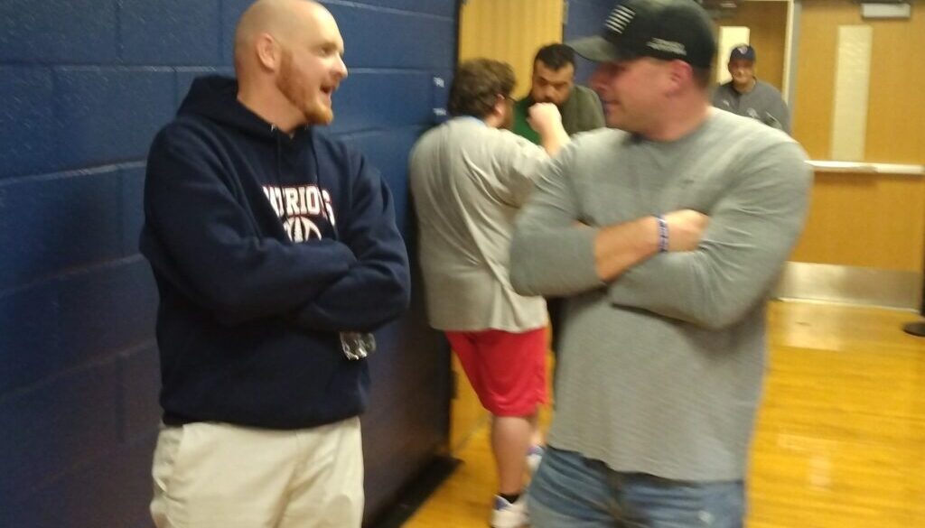 PG football coach David Hayes and former coach Calvin Brown