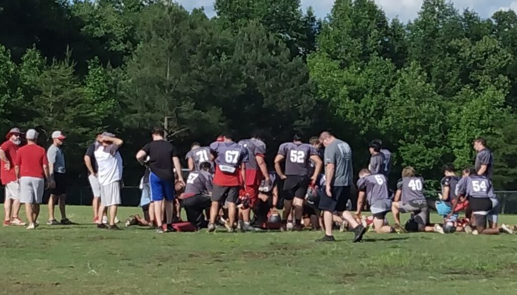 Wheatmore football postpractice huddle May2024