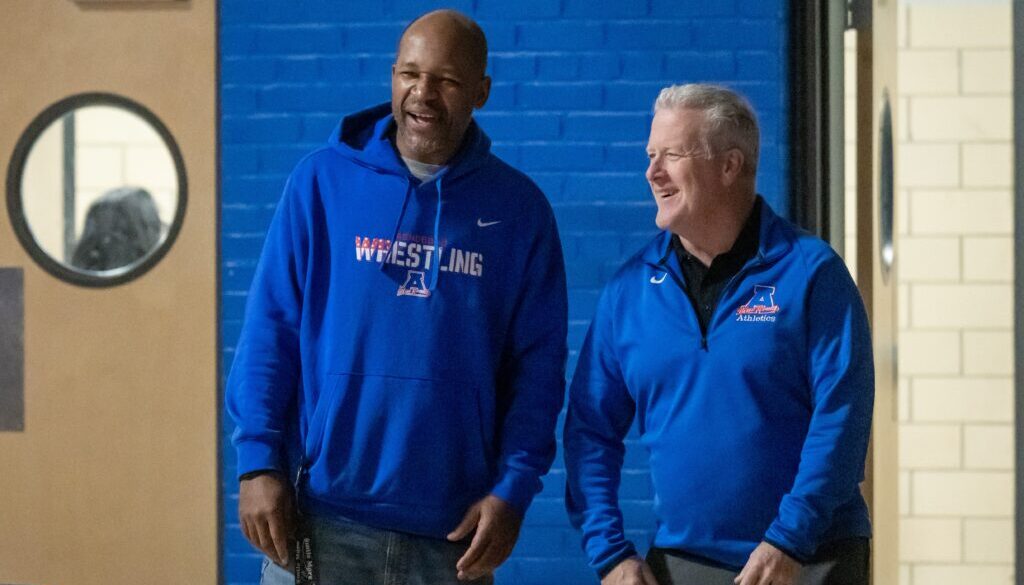 Asheboro wrestling coach Cliff Thompson with man Jan2025
