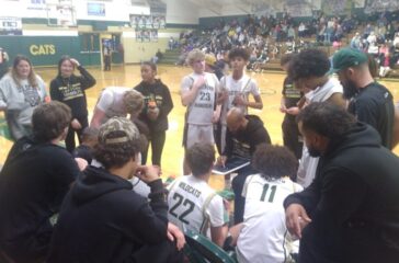 ER boys basketball bench huddle Feb 10 2025