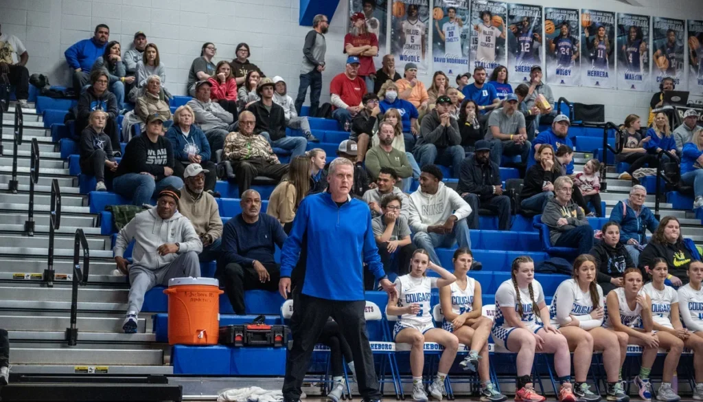 SWR girls basketball coach Seth Baxter near bench Dec2024
