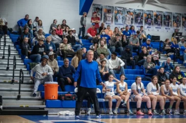 SWR girls basketball coach Seth Baxter near bench Dec2024