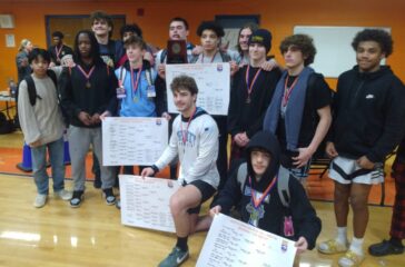 Trinity wrestling team after regional title Feb2025