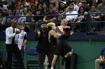 Wheatmore wrestling Ayden Sumners with coach after 2025 final