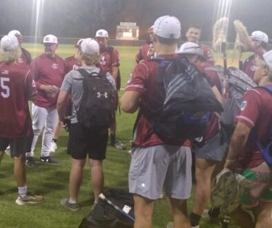 Post 45 huddle after July 1 2025 win at Post 81